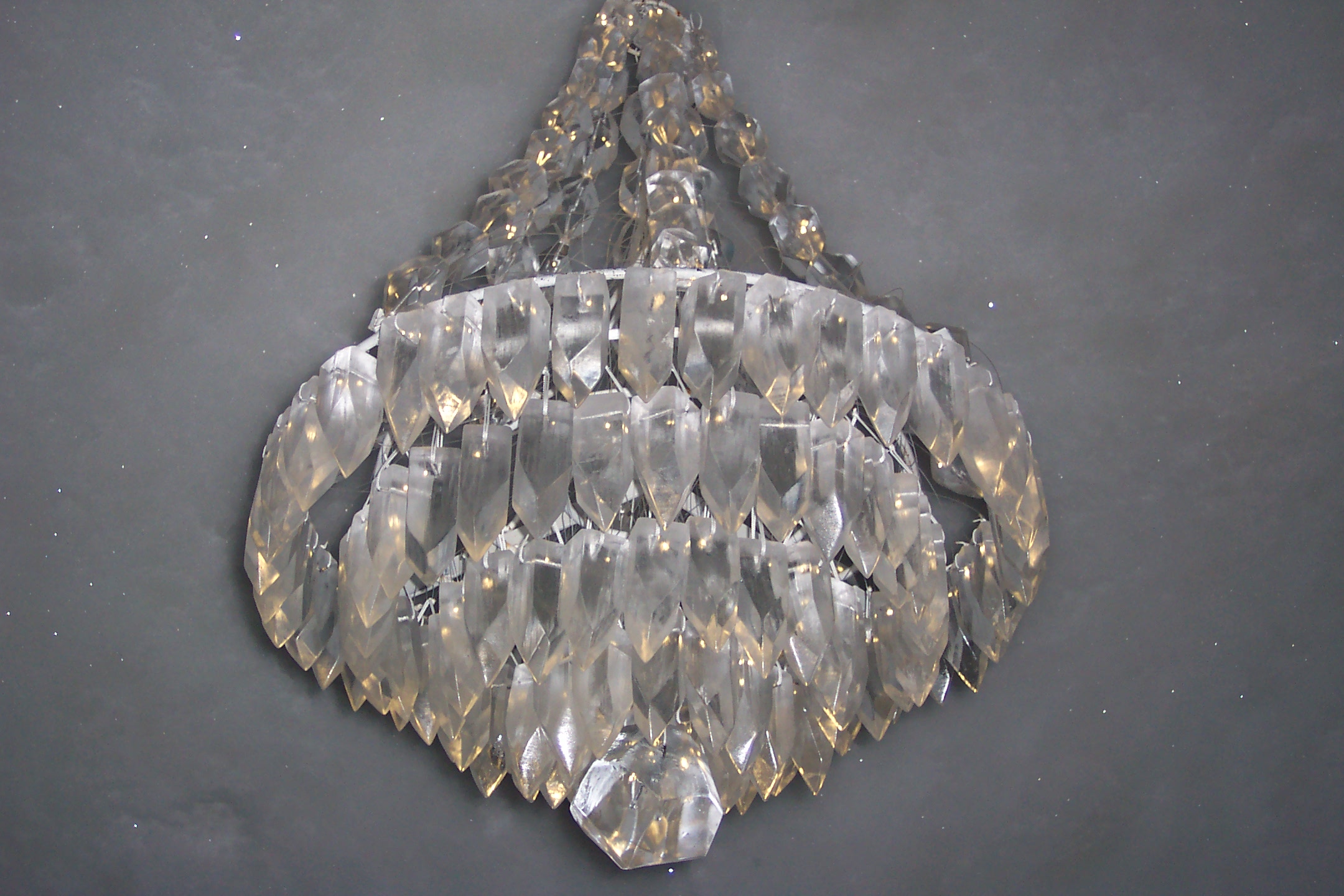 Close up of the chandelier made of ice with a multitude of pedants in circles. 