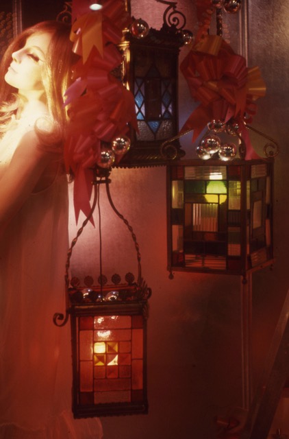 Two square chandeliers made of colourful glass squares. 