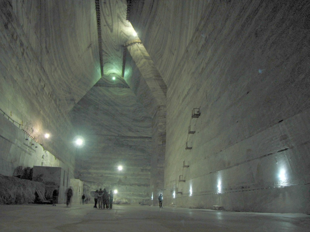 Photo of several bright lights inside the Unirea Salt Mine Complex in Romania. This large room was located 300 meters below ground and would of course be totally dark without the lights. This was from our trip to Romania/Transylvania.