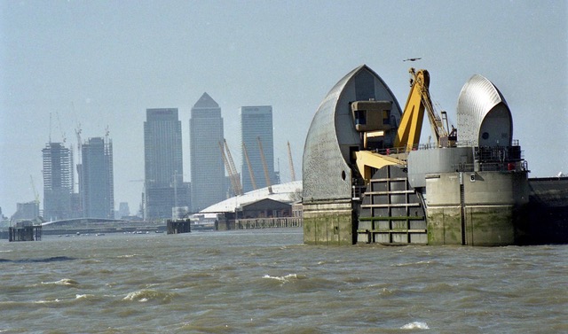 Medium distance shot of the Thames Barrier and the cranes behind it.