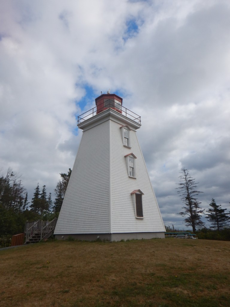 A close up of the lighthouse from the side.