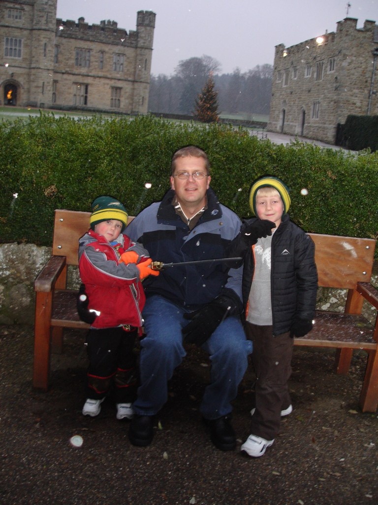 My sons and husband in front of Leeds Castle in the UK. Michael is dressed as a knight although he has a coat over his outfit.